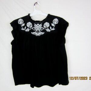 Knox rose mix media black top. Embroidery front & back, ties in back